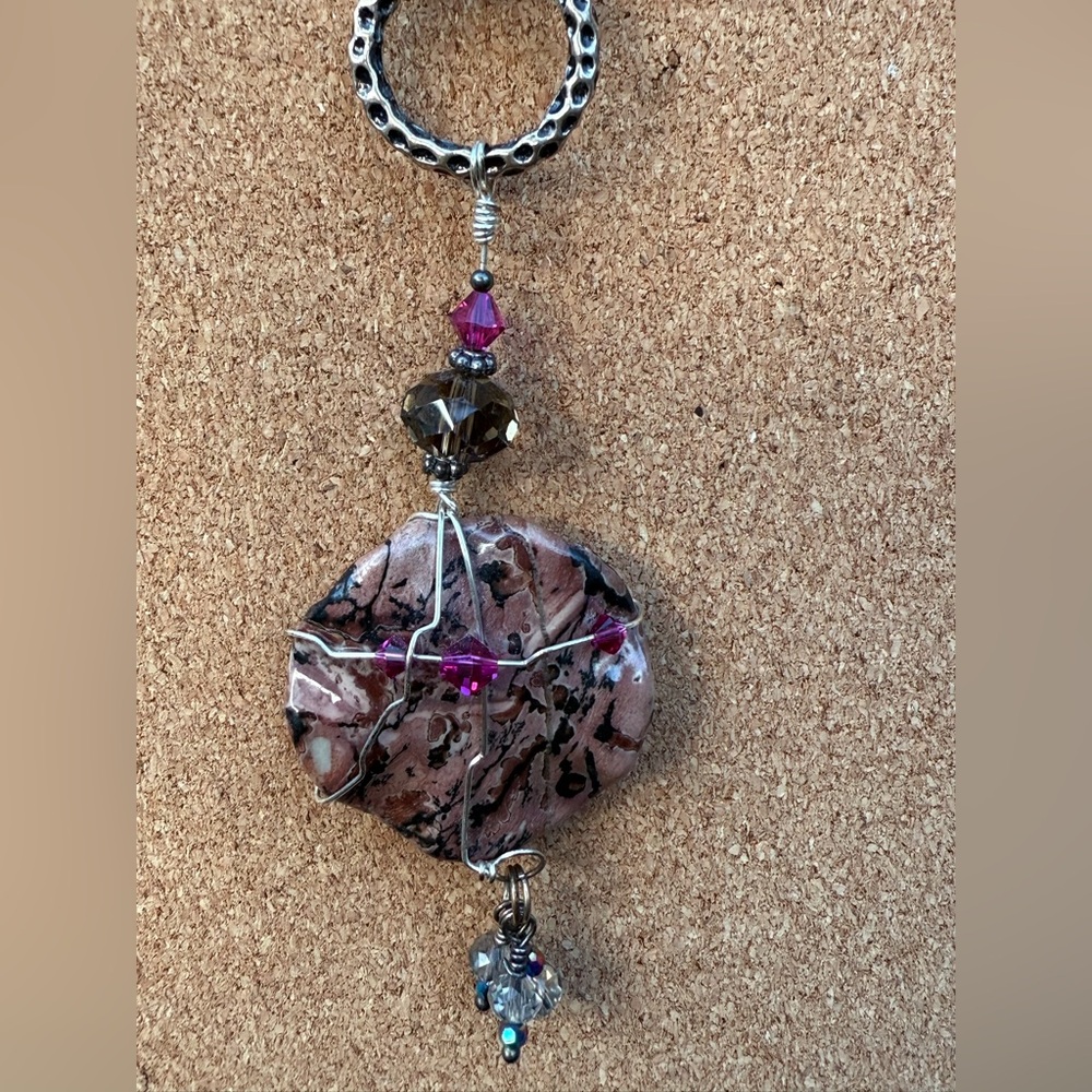 Statement necklace with purple & silver accents and a big stone pendant